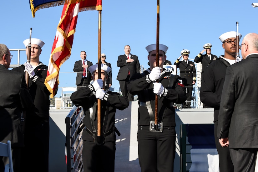 Deputy Defense Secretary Bob Work, center, renders honors during a Defense Advanced Research Projects Agency christening ceremony for a technology demonstration vessel in Portland, Ore., April 7, 2016. DoD photo by Army Sgt. 1st Class Clydell Kinchen