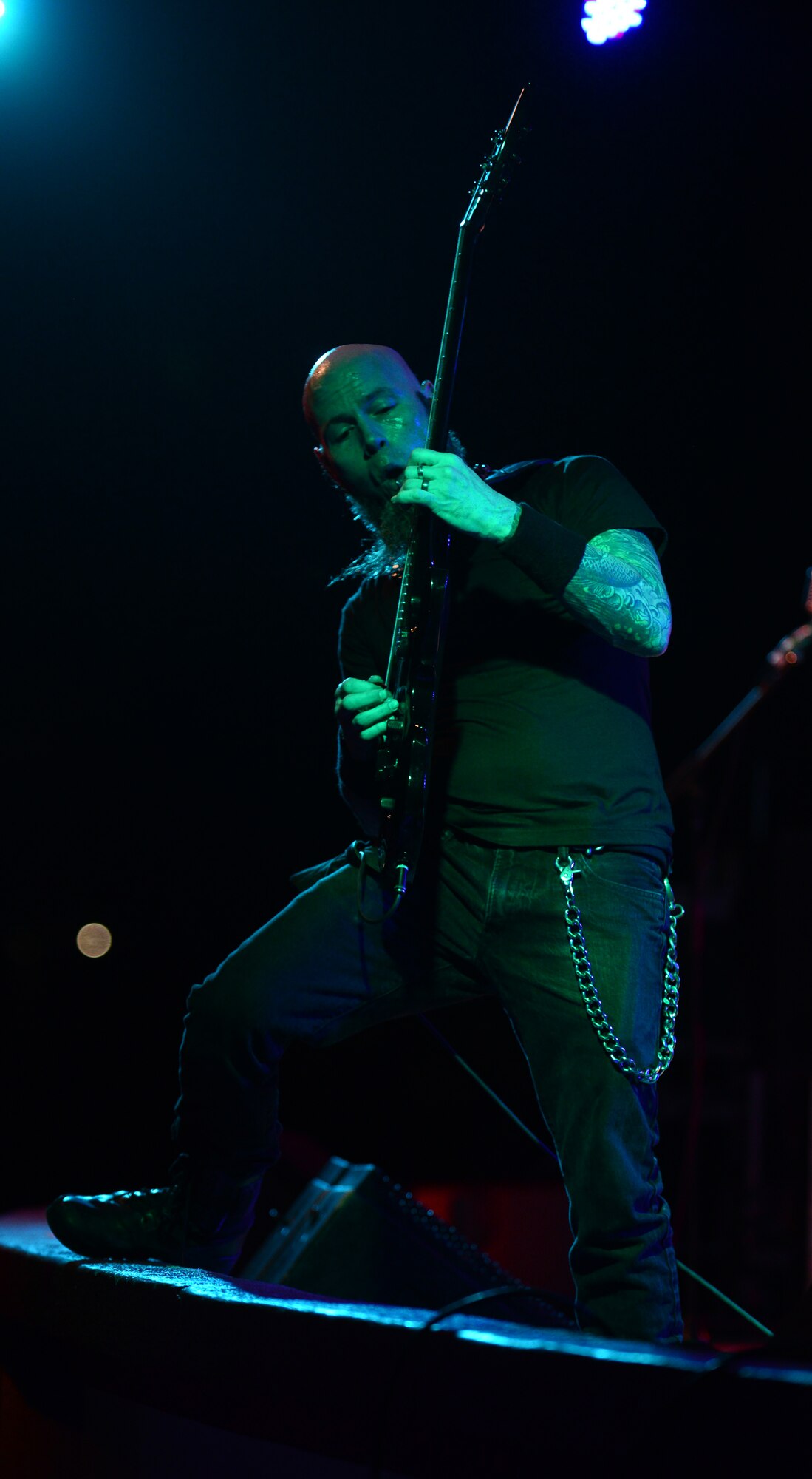 C.J. Pierce, guitarist for Drowning Pool, plays a guitar solo April 6, 2016, at Andersen Air Force Base, Guam. Pierce has been playing guitar for the band since its formation in 1996. (U.S. Air Force photo by Senior Airman Joshua Smoot)