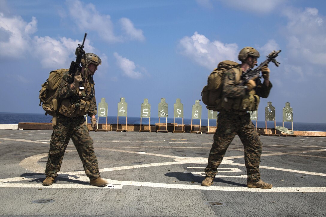 Marines conduct a cautious approach movement before firing their weapons during a deck shoot aboard the USS New Orleans in the Pacific Ocean, April 1, 2016. Marine Corps photo by Sgt. Hector de Jesus