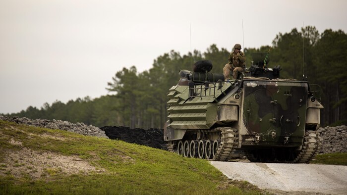 Cpl. Trevor Dodson, a vehicle commander with 2nd Assault Amphibian Battalion, communicates with range control to begin qualifying with an Amphibious Assault Vehicle during Heavy Brigade Combat Team training at Marine Corps Base Camp Lejeune, North Carolina, April 5, 2016. The unit conducts this type of training semi-annually to ensure all their Marines meet the requirements to successfully engage the enemy in a deployed environment.