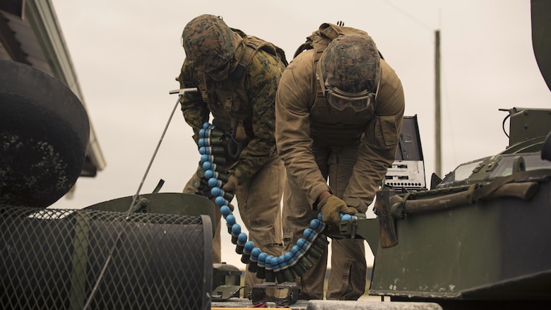 Marines with 2nd Assault Amphibian Battalion load 40 mm practice rounds onto their Amphibious Assault Vehicle during Heavy Brigade Combat Team training at Marine Corps Base Camp Lejeune, North Carolina, April 5, 2016. The AAV also provides accurate .50 caliber suppression to effectively incapacitate enemy combatants.