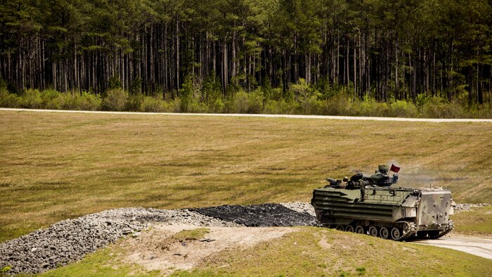 An Amphibious Assault Vehicle with 2nd Assault Amphibian Battalion engages simulated enemy targets during a qualification course during Heavy Brigade Combat Team training at Marine Corps Base Camp Lejeune, North Carolina, April 5, 2016. The training allows the unit to strengthen their working relationship and maintain weapons proficiency to remain being a reliable asset for amphibious operations.