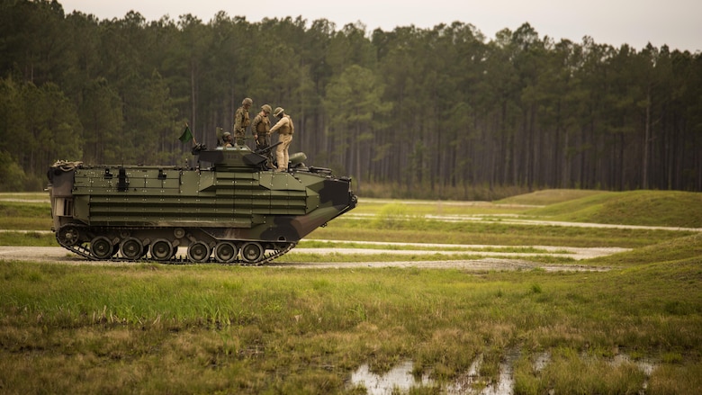 Marines with 2nd Assault Amphibian Battalion inspect their Amphibious Assault Vehicle prior to conducting a qualification course during Heavy Brigade Combat Team training at Marine Corps Base Camp Lejeune, North Carolina, April 5, 2016. The AAV provides other units with accurate suppression and supports maneuver elements for infantry units operating overseas.