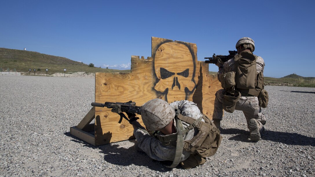 Lance Cpl. Daniel Lopez (right), and Lance Cpl. Corey Johnson, both mortarmen with Weapons Company, 3rd Battalion, 1st Marine Regiment, 1st Marine Division and students with the Urban Leaders Course, fire their M4 carbines from behind a barricade during a combat marksmanship program range at Camp Pendleton March 31, 2016. This range is the first live-fire range of the three-week course, and is designed to hone Marines’ combat marksmanship skills including how to shoot, move and communicate with a buddy. 
