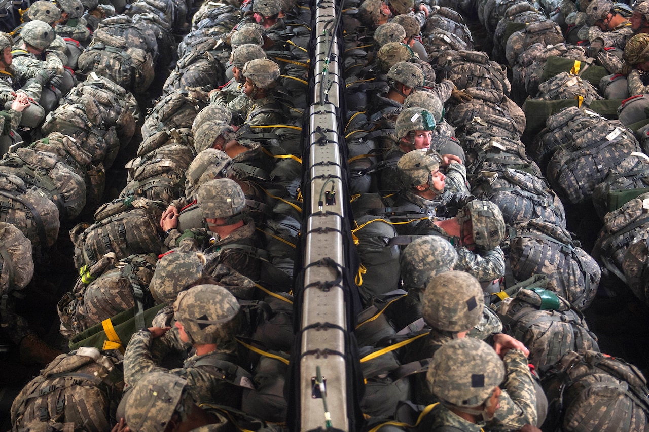 Paratroopers sit in a C-17 Globemaster III aircraft before participating in an airborne operation during Large Package Week at Joint Base Elmendorf-Richardson, Alaska, April 5, 2016. The paratroopers are assigned to the 25th Infantry Division’s 4th Infantry Brigade Combat Team. Air Force photo by Senior Airman James Richardson