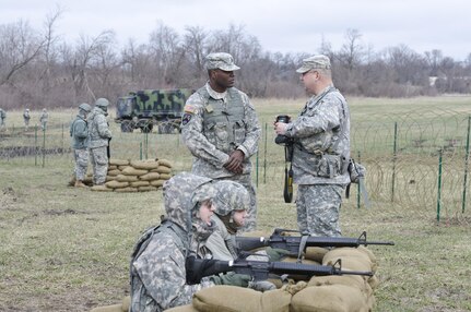 U.S. Army Reserve  Sgt. Joe Villines, with the 203rd Public Affairs Detachment, provides instructional training on camera equipment to a new Soldier at Camp Dodge, Iowa, March 18, 2016. Villines manages to find the balance between his military obligations, his civilian career with the Department of Veterans affairs, fatherhood, and a growing passion in rural farming. Joe is increasing his knowledge on traditional farming and becoming a man of the soil, and in the process giving back to his local community.(U.S. Army Reserve photo by  Brian Godette, USARC Public Affairs)