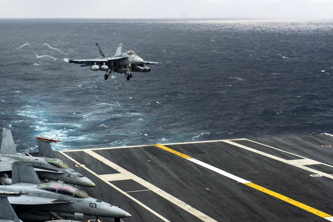 An F/A-18E Super Hornet prepares to make an arrested landing on the flight deck of the aircraft carrier USS Dwight D. Eisenhower in the Atlantic Ocean, March 31, 2016. Navy photo by Specialist Seaman Casey J. Hopkins