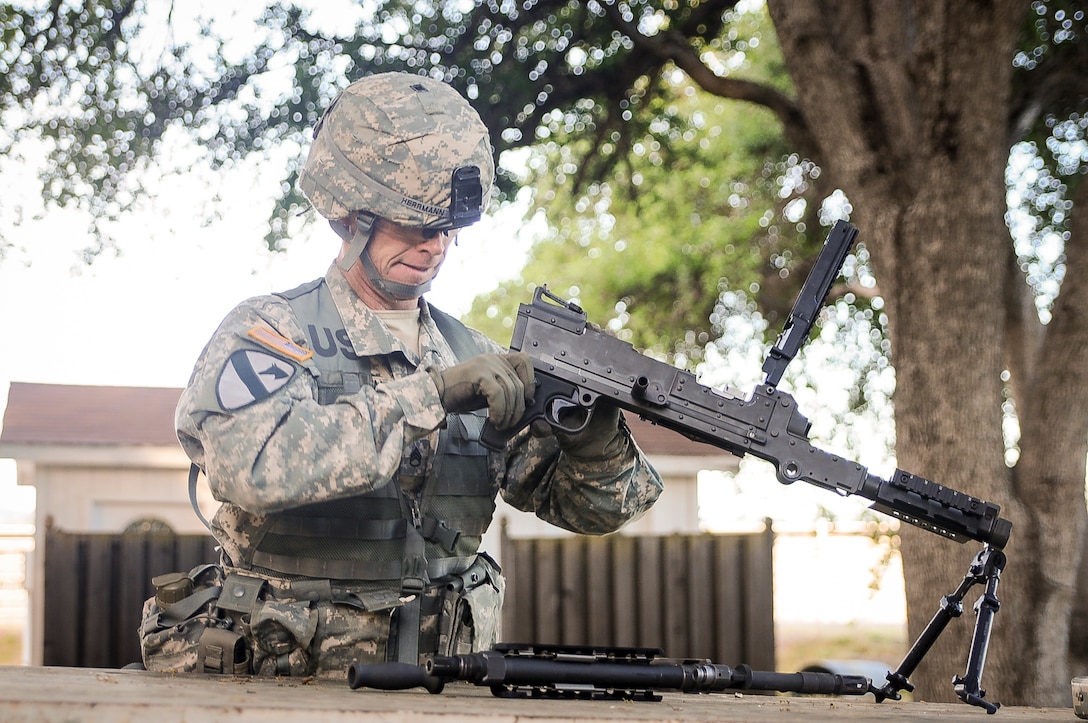 Staff Sgt. Alex Herrmann, a civil affairs specialist from Amarillo, Texas, representing the 350th Civil Affairs Command, competes in the weapons assembly mystery event at the U.S. Army Civil Affairs and Psychological Operations Command 2016 U.S. Army Best Warrior Competition at Fort Hunter Liggett, Calif., April 6, 2016. This year’s Best Warrior competition will determine the top noncommissioned officer and junior enlisted Soldier who will represent USACAPOC in the Army Reserve Best Warrior competition later this year. (U.S. Army photo by Spc. Khadijah Lutz-Wilcox, USACAPOC)