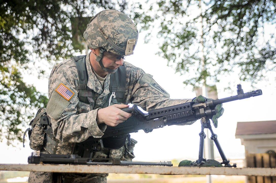Spc. Ian Duprey, a chaplain's assistant from Hague, Va., representing the 437th Civil Affairs Battalion, competes in the weapons assembly mystery event at the U.S. Army Civil Affairs and Psychological Operations Command 2016 U.S. Army Best Warrior Competition at Fort Hunter Liggett, Calif., April 6, 2016. This year’s Best Warrior competition will determine the top noncommissioned officer and junior enlisted Soldier who will represent USACAPOC in the Army Reserve Best Warrior competition later this year. (U.S. Army photo by Spc. Khadijah Lutz-Wilcox, USACAPOC)