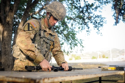 Sgt. Maxwell Buchanan-McGrath, a psychological operations specialist from Bradenton, Fla., representing the 2nd Psychological Operations Group,  competes in the weapons assembly mystery event at the U.S. Army Civil Affairs and Psychological Operations Command 2016 U.S. Army Best Warrior Competition at Fort Hunter Liggett, Calif., April 6, 2016. This year’s Best Warrior competition will determine the top noncommissioned officer and junior enlisted Soldier who will represent USACAPOC in the Army Reserve Best Warrior competition later this year. (U.S. Army photo by Spc. Khadijah Lutz-Wilcox, USACAPOC)