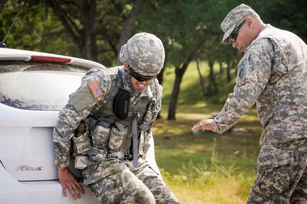 Spc. Nicholas Ladolcetta, an information technology specialist from Staten Island, N.Y., representing the 151st Theater Information Operations Group, competes in mystery event pushing a vehicle at the U.S. Army Civil Affairs and Psychological Operations Command 2016 U.S. Army Best Warrior Competition at Fort Hunter Liggett, Calif., April 6, 2016. This year’s Best Warrior competition will determine the top noncommissioned officer and junior enlisted Soldier who will represent USACAPOC in the Army Reserve Best Warrior competition later this year. (U.S. Army photo by Spc. Khadijah Lutz-Wilcox, USACAPOC)