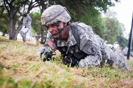 Staff Sgt. Jonathan Stamper, a civil affairs specialist from Hermosa Beach, Calif., representing the 1st Training Brigade, competes in mystery event by high crawling at the U.S. Army Civil Affairs and Psychological Operations Command 2016 U.S. Army Best Warrior Competition at Fort Hunter Liggett, Calif., April 6, 2016. This year’s Best Warrior competition will determine the top noncommissioned officer and junior enlisted Soldier who will represent USACAPOC in the Army Reserve Best Warrior competition later this year. (U.S. Army photo by Spc. Khadijah Lutz-Wilcox, USACAPOC)