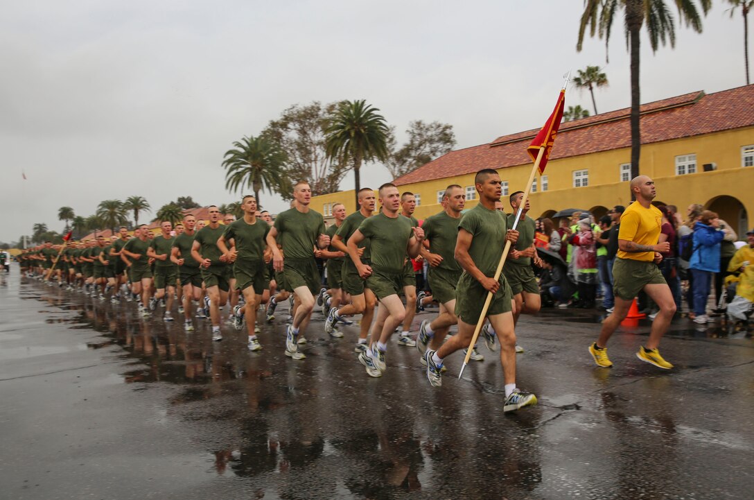 Marines of Hotel Company, 2nd Recruit Training Battalion, run in formation during their motivation run at Marine Corps Recruit Depot San Diego, April 7. After the Marines graduate recruit training, they receive 10 days of leave before reporting to the School of Infantry at Marine Corps Base Camp Pendleton, Calif., for Marine Combat Training. Annually, more than 17,000 males recruited from the Western Recruiting Region are trained at MCRD San Diego. Hotel Company is scheduled to graduate April 8.