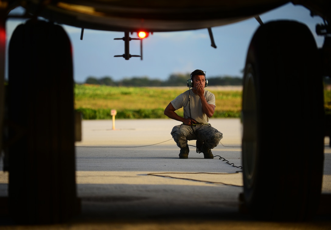 Senior Airman Joeyfel Abayon, a 36th Expeditionary Aircraft Maintenance Squadron crew chief, performs a pre-flight inspection on a B-52 Stratofortress March 21, 2016, at Andersen Air Force Base, Guam. The U.S. Pacific Command has maintained a rotational strategic bomber presence in the Indo-Asia-Pacific Region for more than a decade. (U.S. Air Force photo/Senior Airman Joshua Smoot)