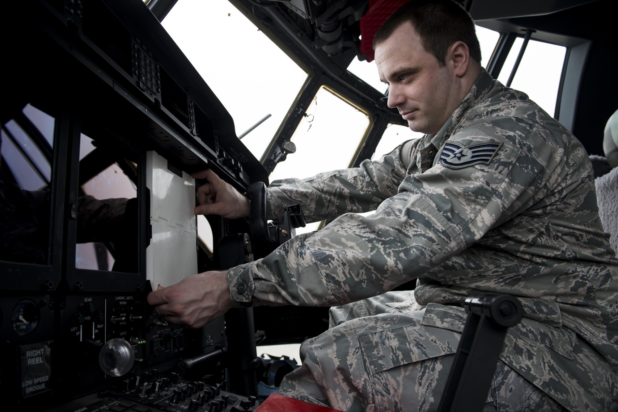 Staff Sgt. Matthew Farmer, 352d Special Operations Aircraft Maintenance Squadron Aerospace Propulsion Craftsman, outfits an MC-130J Commando II’s Color Multi-Purpose Display with a 3D printed cover on RAF Mildenhall, April 8, 2016. Farmer designed the covers to protect the $70k screens from damage occurring during routine maintenance. Farmer submitted his ideas through the Airmen Powered by Innovation program and was notified that both were approved with a plan to implement. (U.S. Air Force photo by 1st Lt Chris Sullivan/Released)