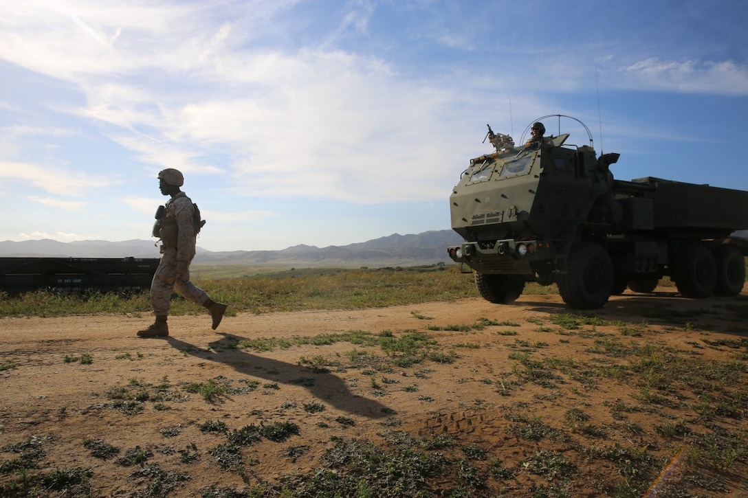 MARINE CORPS BASE CAMP PENDLETON, Calif. - A Marine with Battery Q, 5th Battalion, 11th Marine Regiment, I Marine Expeditionary Force, guides a High Mobility Artillery Rocket System launcher during Spring Fire Exercise at Camp Pendleton March 31, 2016. The regiment, comprised of four artillery battalions and a headquarters battalion, put their skills to the test during a large-scale, combined-arms training evolution in preparation for future deployments and operations.  (U.S. Marine Corps Photo by Cpl. Demetrius Morgan/RELEASED)