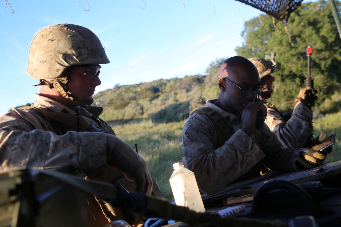 MARINE CORPS BASE CAMP PENDLETON, Calif. - Marines with Battery Q, 5th Battalion, 11th Marine Regiment, I Marine Expeditionary Force, coordinate road guard posts during Spring Fire Exercise at Camp Pendleton March 31, 2016. During the combined-arms training exercise, Staff Sgt. Albert Macklin, a battery local security chief, and other Marines helped coordinate where all security posts were, along with securing the various parts of the range in accordance with where the battery was firing. (U.S. Marine Corps Photo by Cpl. Demetrius Morgan/NOT RELEASED)