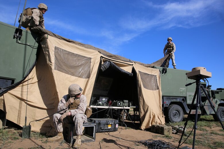 MARINE CORPS BASE CAMP PENDLETON, Calif. - Marines with Battery Q, 5th Battalion, 11th Marine Regiment, I Marine Expeditionary Force, set up the Fire Direction Center during Spring Fire Exercise at Camp Pendleton March 31, 2016. To ensure readiness, fire missions were coordinated and called at random intervals by the headquarters element. The Marines manning the artillery weapons were ready to fire swiftly and accurately upon command during the combined-arms training exercise. (U.S. Marine Corps Photo by Cpl. Demetrius Morgan/RELEASED)