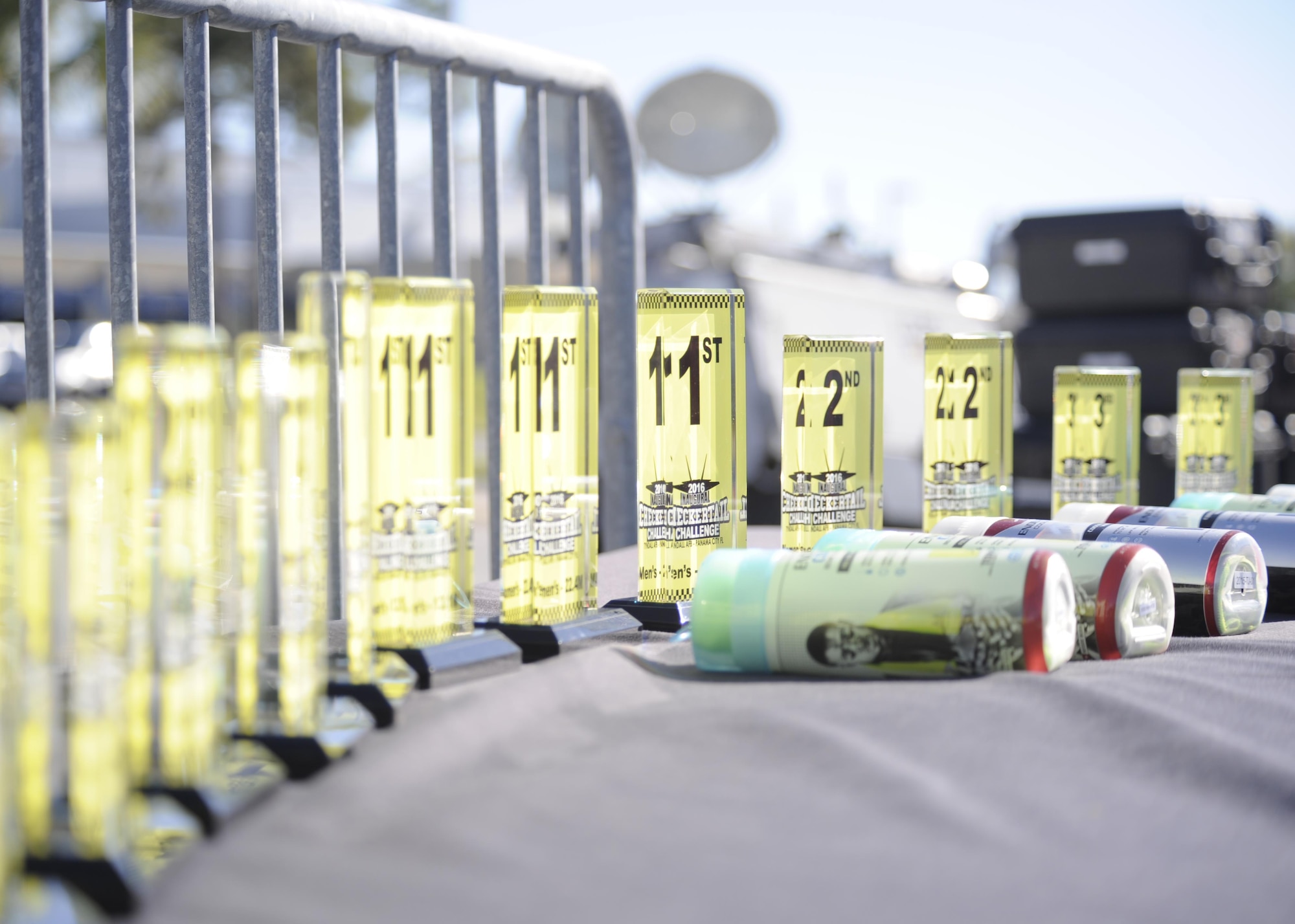 Checkertail Challenge trophies sit on display April 3, at the race finish line. The Checkertail Challenge was a 3-day competition comprised of three running events; a 5K, 10k and a 13.1 mile run. All of these events culminated in the “Checker Tailgate;” a post-race festivity that featured bounce houses for children provided by Bonita Bay Outdoor Recreation, and food provided by the Horizon Club staff. (U.S.  Air Force photo by Senior Airman Solomon Cook/Released)