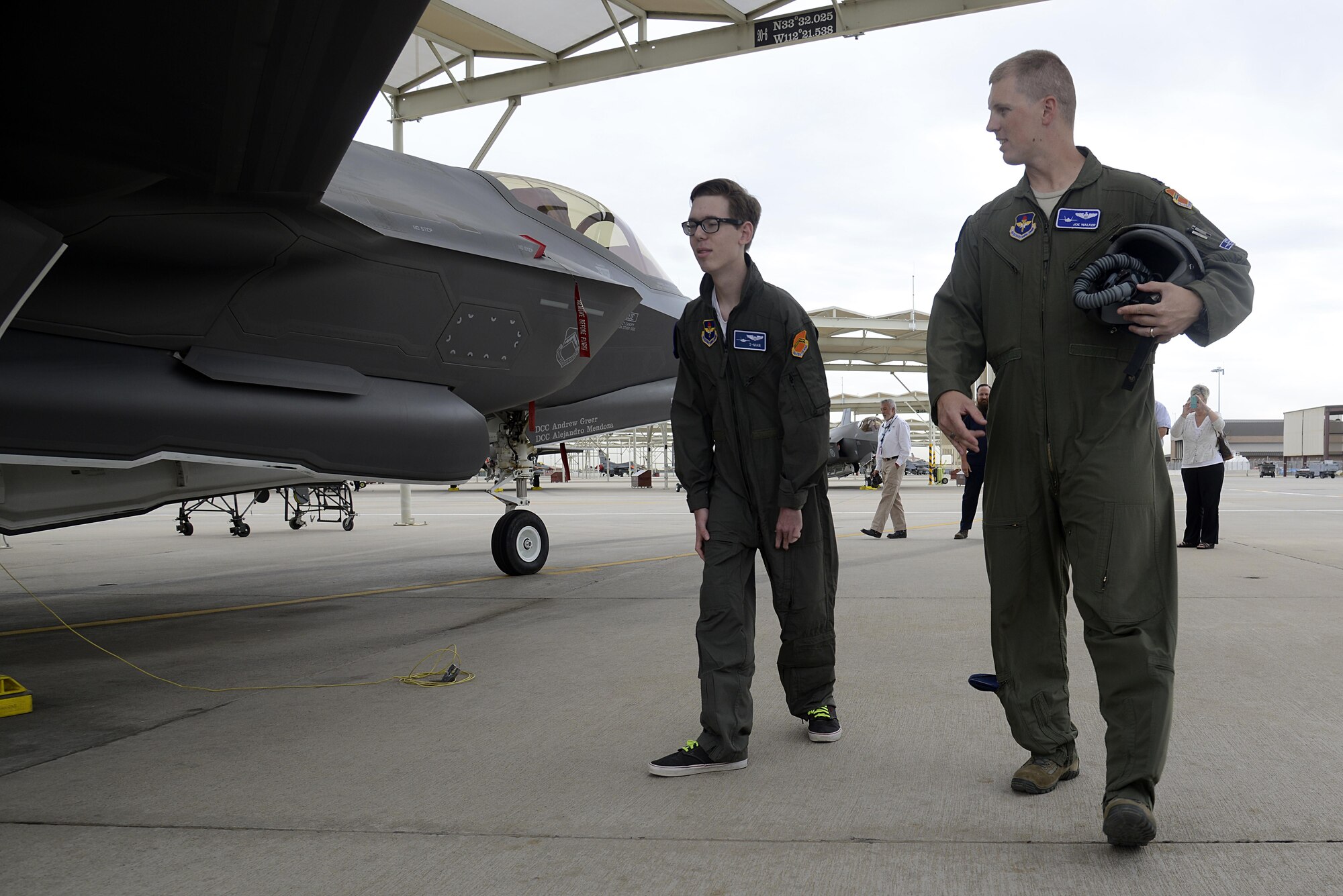 Capt. Joseph Walker, 62nd Fighter Squadron flight commander, shows Zach "Z-man" Anderson, 16, the F-35 Lightning II during his tour of the squadron at Luke Air Force Base, Ariz., April 7, 2016. Anderson received the tour as part of the pilot for a day program, which provides children who have serious or chronic illnesses an opportunity to be part of a flying squadron for an entire day. (U.S. Air Force photo by Senior Airman Devante Williams)