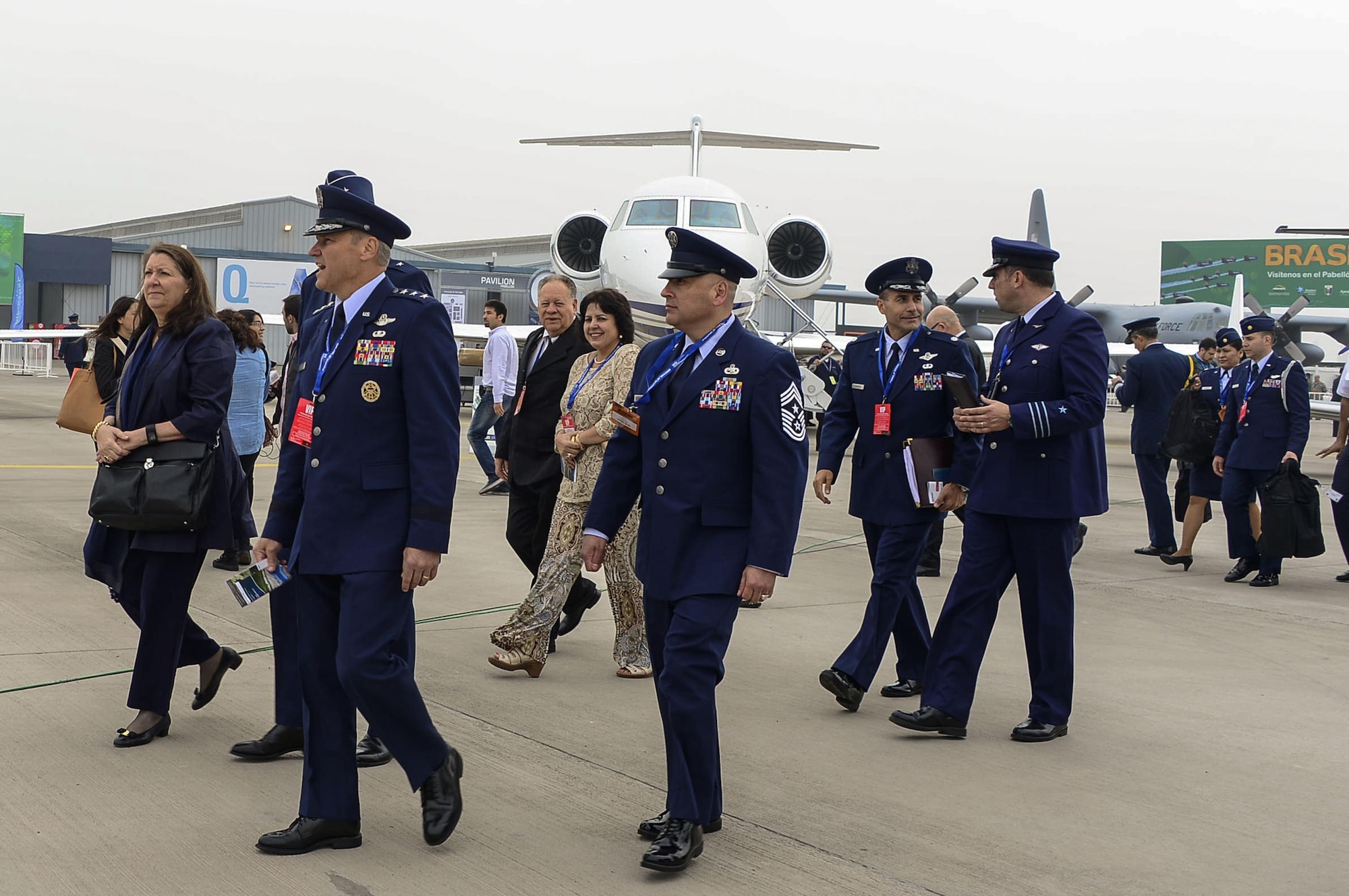 Lt. Gen. Chris Nowland, 12th Air Force (Air Forces Southern) commander, and Chief Master Sgt. Jose Barraza, 12 AF (AFSOUTH) command chief, head into the exhibition center during the opening of the 2016 International Air and Space Fair (FIDAE) in Santiago, Chile, March 29, 2016. Airmen from around the U.S. are scheduled to participate in a variety of activities during the week-long air show that includes aerial demonstrations, interaction with the local community, and subject matter expert exchanges with the Chilean air force. (U.S. Air Force photo by Tech. Sgt. Heather Redman/Released)