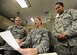 Master Sgt. Tricia DeLuna, AFNORTH force management branch manager, reviews manpower documents with Senior Airman Charlott Lemonds, AFNORTH career development technician and Staff Sgt. Delayne Griffin, AFNORTH force management branch NCO in-charge, April 4 at the Killey Center for Homeland Operations. DeLuna, Lemonds and Griffin work within the A1-manpower and personnel section as well as manage all AFNORTH personnel related concerns. (U.S. Air Force photo by Senior Airman Ty-Rico Lea/Released)