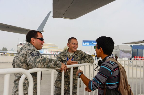 Master Sgt. Mario Munive and Lt. Daniel Grotte, from the Houston Air National Guard, Texas, speak to visitors about the capabilities of the MQ-1 Predator during the 2016 International Air and Space Fair (FIDAE) in Santiago, Chile, March 30, 2016. During FIDAE, U.S. Airmen participated in in several subject matter expert exchanges with their Chilean counterparts and also hosted static displays and aerial demonstrations to support the air show.  (U.S. Air Force photo by Tech. Sgt. Heather Redman/Released)