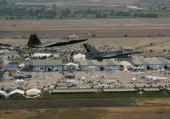 An F-22 Raptor, from the F-22 Demonstration Team at Langley AFB, Va., flies in formation with a Chilean F-16 Fighting Falcon over the 2016 International Air and Space Fair (FIDAE) in Santiago, Chile, April 1, 2016, 2016. During the FIDAE Air and Space Trade Show, U.S. Airmen participated in several subject matter expert exchanges with their Chilean counterparts and also hosted static displays and aerial demonstrations to support the air show.  (U.S. Air Force photo by Senior Airman Danny Rangel/Released)