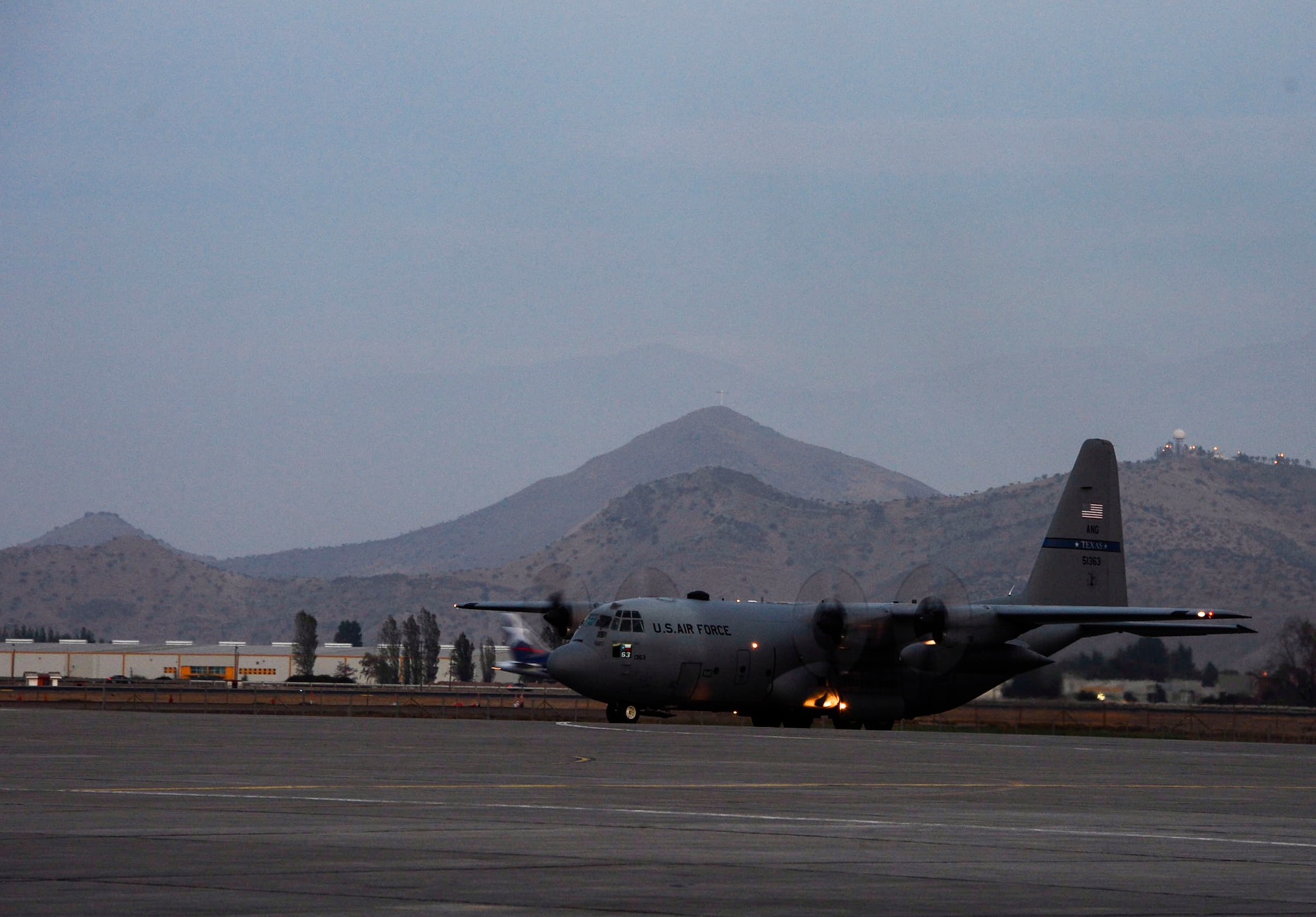 A C-130 from the Texas Air National Guard taxis into Santiago, Chile, to participate in the 2016 International Air and Space Fair (FIDAE), on March 27, 2016.  Airmen from around the U.S. are scheduled to participate in a variety of activities during the week-long air show that includes aerial demonstrations, interaction with the local community, and subject matter expert exchanges with the Chilean air force. (U.S. Air Force photo by Tech. Sgt. Heather Redman/Released)