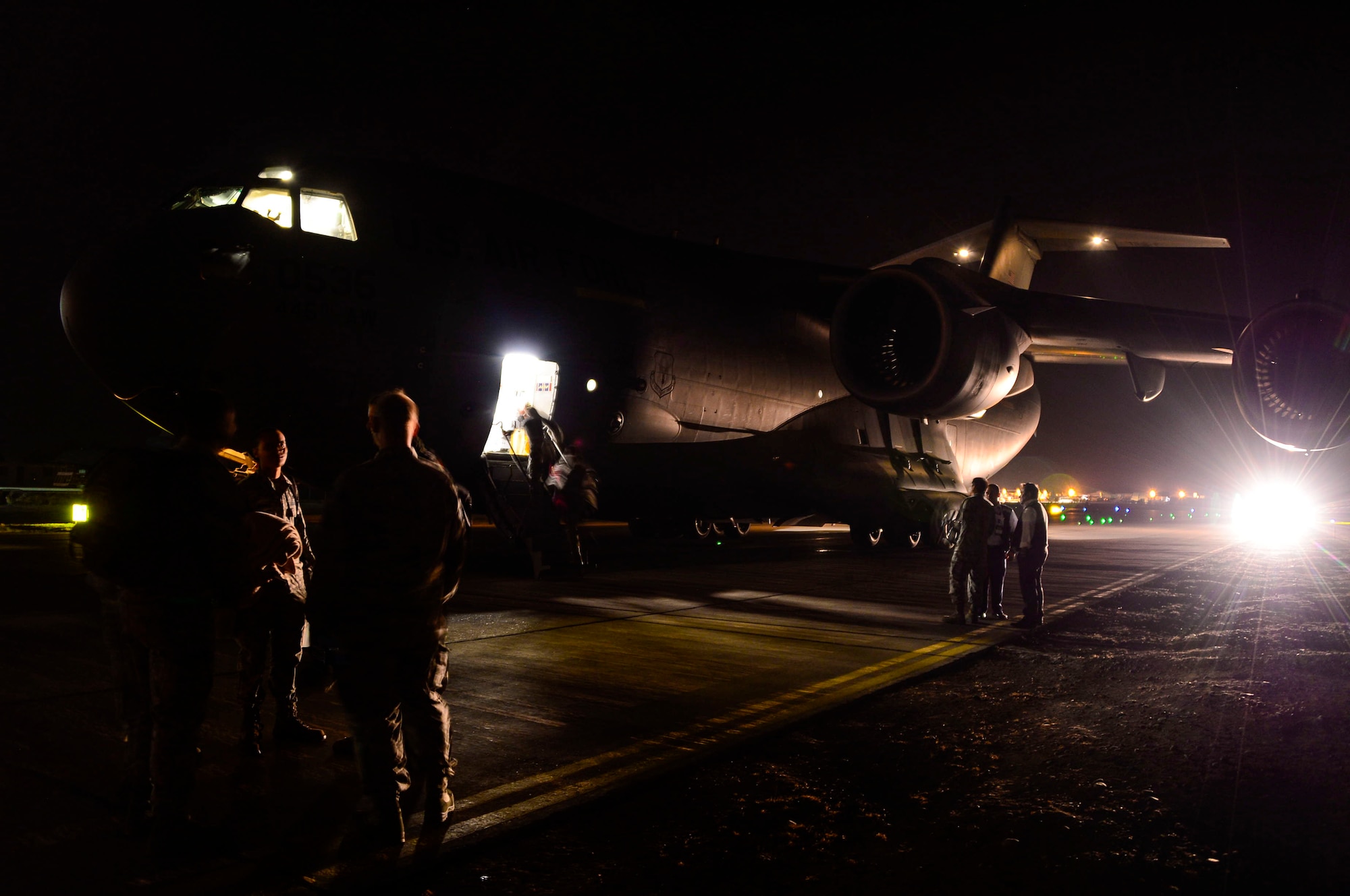 U.S. Airmen, from Wright-Patterson AFB, Ohio, disembark a C-17 Globemaster III in Santiago, Chile, for the 2016 International Air and Space Fair (FIDAE), March 27, 2016.  Airmen from around the U.S. are scheduled to participate in a variety of activities during the week-long air show that includes aerial demonstrations, interaction with the local community, and subject matter expert exchanges with the Chilean air force. (U.S. Air Force photo by Tech. Sgt. Heather Redman/Released)