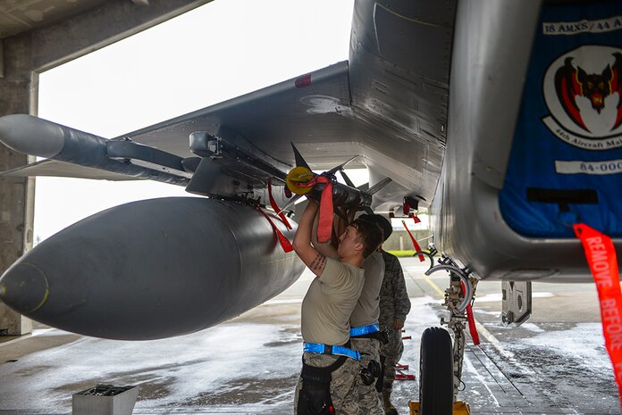 U.S. Air Force 18th Aircraft Maintenance Squadron weapons load crew members, load an AIM-9X missile during a weapons load competition April 5, 2016, at Kadena Air Base, Japan. The AIM-9X is an air-to-air, heat-seeking missile used by U.S. Air Force fighter aircraft. 
