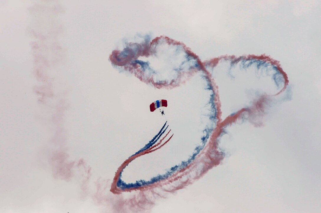 Members from the U.S. Air Force skydiving team, Wings of Blue, perform over the 2016 International Air and Space Fair (FIDAE) in Santiago, Chile, April 1, 2016. During FIDAE, U.S. Airmen participated in in several subject matter expert exchanges with their Chilean counterparts and also hosted static displays and aerial demonstrations to support the air show.  (U.S. Air Force photo by Tech. Sgt. Heather Redman/Released)