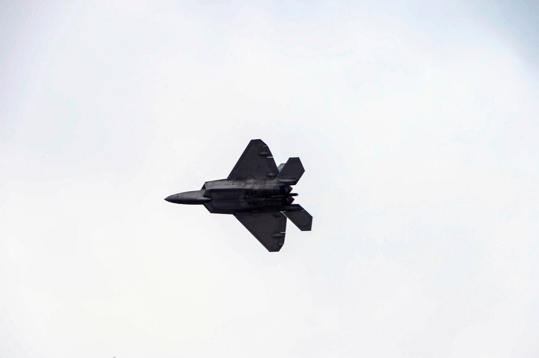 An F-22 Raptor, from the F-22 Raptor Demonstration Team at Langley AFB, Va., performs its aerial acrobatics routine at the 2016 International Air and Space Fair (FIDAE) in Santiago, Chile, April 1, 2016. During FIDAE, U.S. Airmen participated in in several subject matter expert exchanges with their Chilean counterparts and also hosted static displays and aerial demonstrations to support the air show.  (U.S. Air Force photo by Tech. Sgt. Heather Redman/Released)