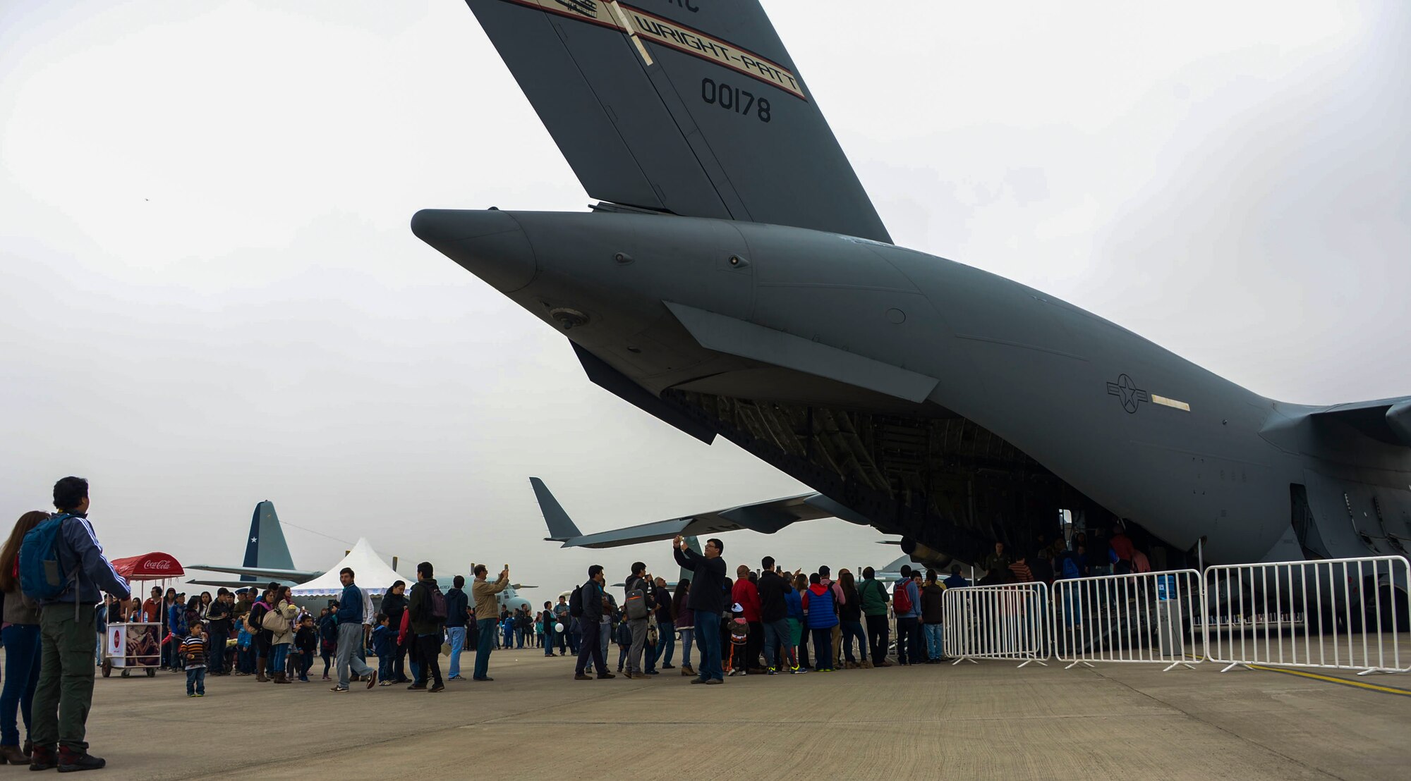 Hundreds of people gather to tour the C-17 Globemaster III, from Wright-Patterson AFB, Ohio, at the 2016 International Air and Space Fair (FIDAE) in Santiago, Chile April 2, 2016.  Airmen from around the U.S. are scheduled to participate in a variety of activities during the week-long air show that includes aerial demonstrations, interaction with the local community, and subject matter expert exchanges with the Chilean air force. (U.S. Air Force photo by Tech. Sgt. Heather Redman/Released)