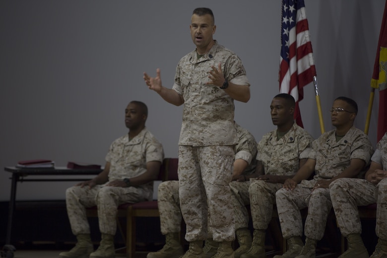 Master Gunnery Sgt. Carl Bisson, communications chief, Communication Training Battalion, addresses students of the Communications Chief Course 1-16 during the course’s graduation ceremony at the base theater April 1, 2016. (Official Marine Corps Photo by Cpl. Julio McGraw/Released)