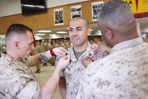 Tucson, Ariz.-Native Luis A. Ochoa, an embarker with Chemical Biological Incident Response Force is promoted to the rank of staff sergeant during a ceremony at Chemical Biological Incident Response Force (CBIRF) headquarters aboard Naval Support Facility Indian Head, Md., April 4, 2016. When directed, CBIRF forward-deploys and/or responds with minimal warning to a chemical, biological, radiological, nuclear and high yield explosive (CBRNE) threat or event in order to assist local, state, or federal agencies and the geographic combatant commanders in the conduct of CBRNE response or consequence management operations, providing capabilities for command and control; agent detection and identification; search, rescue, and decontamination; and emergency medical care for contaminated personnel. (Official USMC Photos by Sgt. Jonathan Herrera)