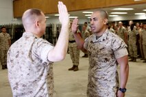 Tucson, Ariz.-Native Luis A. Ochoa, an embarker with Chemical Biological Incident Response Force is promoted to the rank of staff sergeant during a ceremony at Chemical Biological Incident Response Force (CBIRF) headquarters aboard Naval Support Facility Indian Head, Md., April 4, 2016. When directed, CBIRF forward-deploys and/or responds with minimal warning to a chemical, biological, radiological, nuclear and high yield explosive (CBRNE) threat or event in order to assist local, state, or federal agencies and the geographic combatant commanders in the conduct of CBRNE response or consequence management operations, providing capabilities for command and control; agent detection and identification; search, rescue, and decontamination; and emergency medical care for contaminated personnel. (Official USMC Photos by Sgt. Jonathan Herrera)