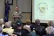 Col. Mark Slocum, 4th Fighter Wing commander, speaks to former members of the 335th Tactical Fighter Squadron, April 1, 2016, at Seymour Johnson Air Force Base, North Carolina. The veterans and retirees all served with the squadron between 1972 and 1975. (U.S. Air Force photo/Airman 1st Class Aaron J. Jenne)