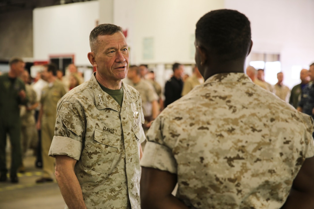 Lt. Gen. Jon Davis, deputy commandant of Marine Corps Aviation, talks to a Marine with Marine Aviation Logistics Squadron (MALS) 16 during the “Boots on the Ground” event aboard Marine Corps Air Station Miramar, Calif., April 5. “Boots on the Ground” allows senior leaders the opportunity to tour squadrons, meet with maintenance personnel and discuss how to better support aviation readiness requirements. (U.S. Marine Corps photo by Cpl. Alissa P. Schuning/Released)