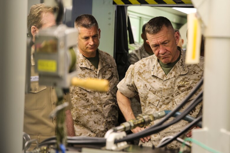 Lt. Gen. Jon Davis, deputy commandant for Marine Corps Aviation, observes a presentation by a Marine with Marine Aviation Logistics Squadron (MALS) 16 during the “Boots on the Ground” event aboard Marine Corps Air Station Miramar, Calif., April 5. “Boots on the Ground” allows senior leaders the opportunity to tour squadrons, meet with maintenance personnel and discuss how to better support aviation readiness requirements. (U.S. Marine Corps photo by Cpl. Alissa P. Schuning/Released)