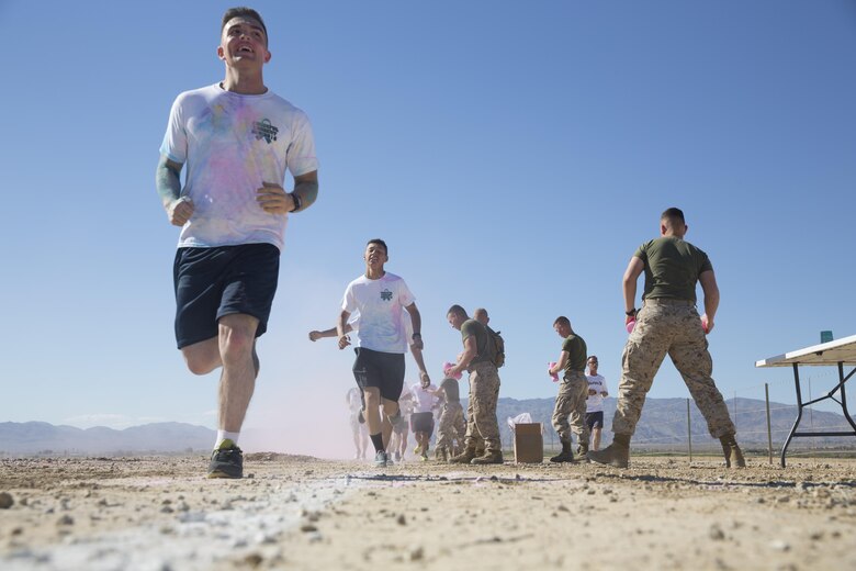 Runners pass through a check point during the Sexual Assault Prevention and Response annual Colorful Consent 5k Run held aboard the Combat Center, April 1, 2016. (Official Marine Corps photo by Cpl. Thomas Mudd/Released)