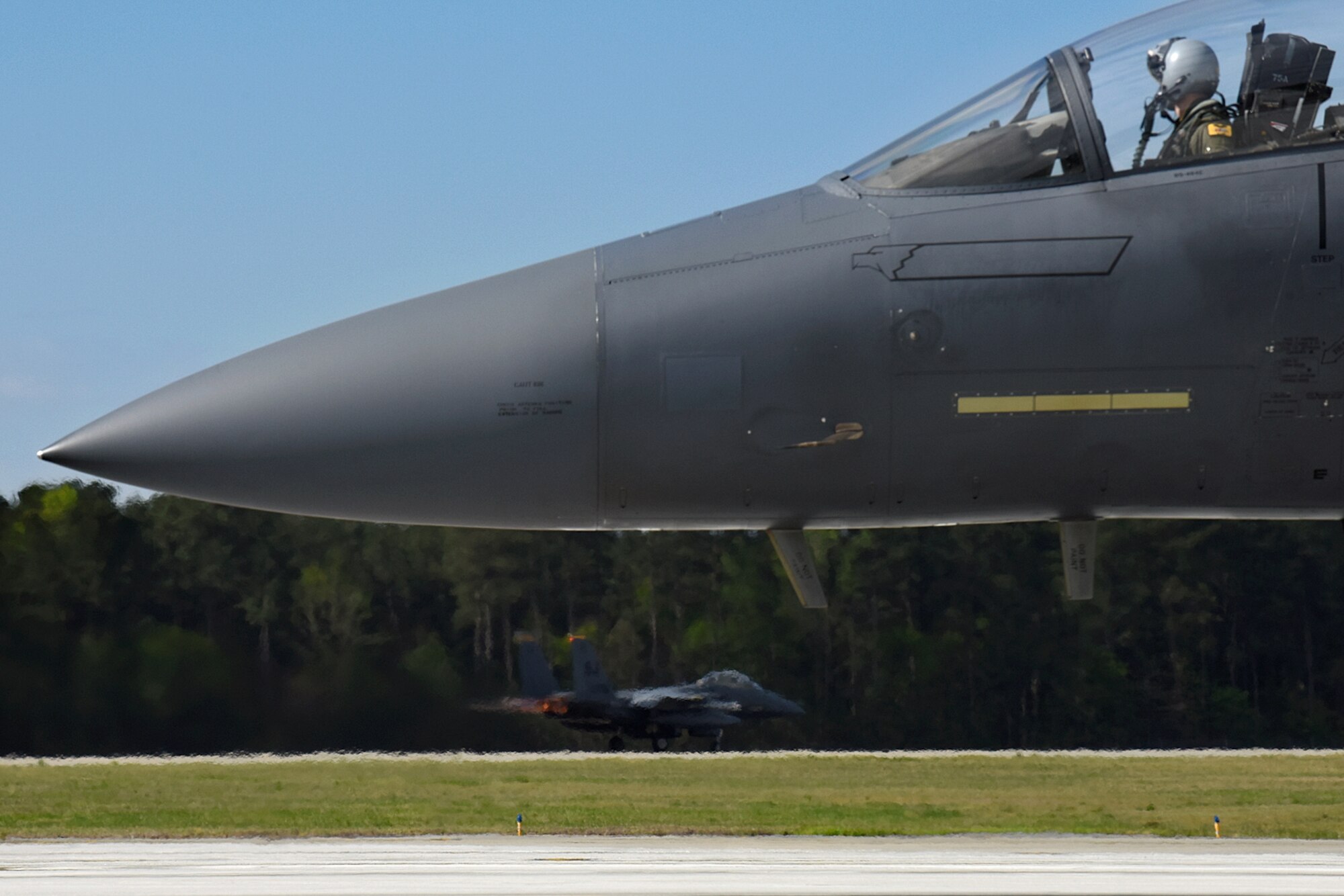 An F-15E Strike Eagle aircraft takes off as another stands by during Razor Talon, April 8, 2016, at Seymour Johnson Air Force Base, North Carolina. Razor Talon, developed at Seymour Johnson AFB, offers joint integration and training opportunities for every branch of the armed services. (U.S. Air Force photo/ Senior Airman Aaron J. Jenne)