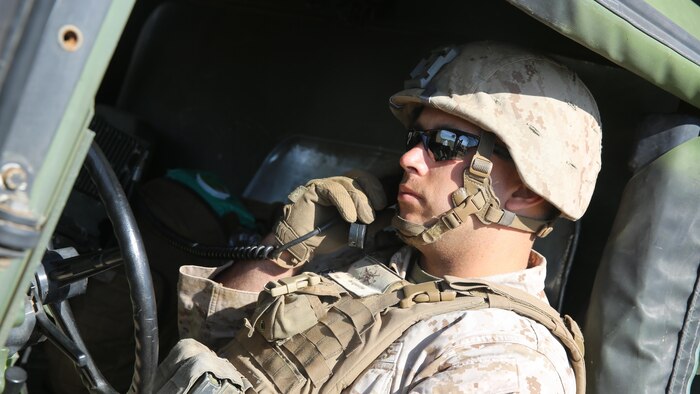 A Marine with Battery Q, 5th Battalion, 11th Marine Regiment, I Marine Expeditionary Force, tests high frequency communications during Spring Fire Exercise at Marine Corps Base Camp Pendleton, California, March 31, 2016. During the combined arms training exercise, Marines used high frequency communications, which utilizes satellites, to communicate with command centers from miles away.