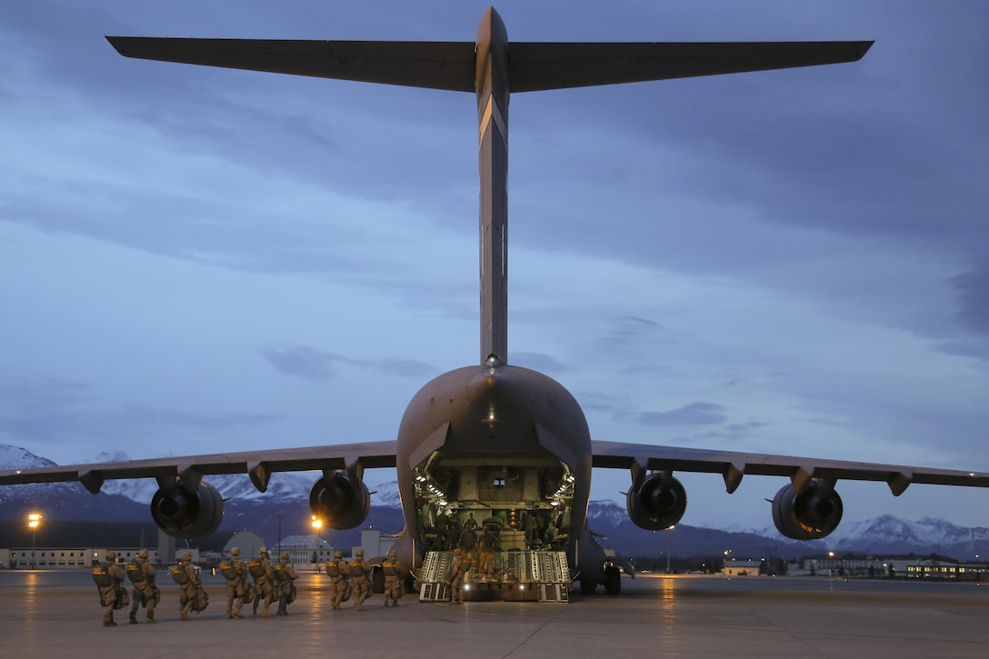 Paratroopers board an Air Force C-17 Globemaster III aircraft before participating in a night jump at Joint Base Elmendorf-Richardson, Alaska, March 31, 2016. Air Force photo by Alejandro Pena