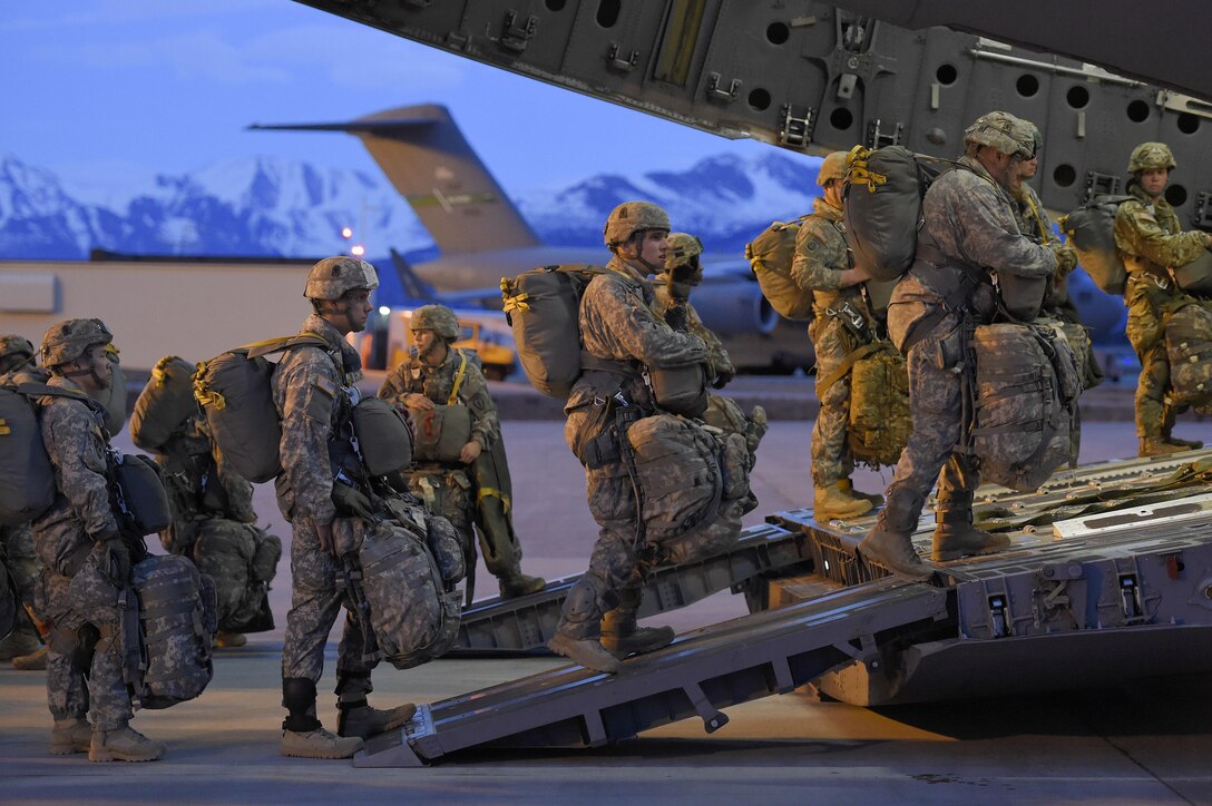 Paratroopers wait to board an Air Force C-17 Globemaster III aircraft before participating in a night jump at Joint Base Elmendorf-Richardson, Alaska, March 31, 2016. Air Force photo by Alejandro Pena
