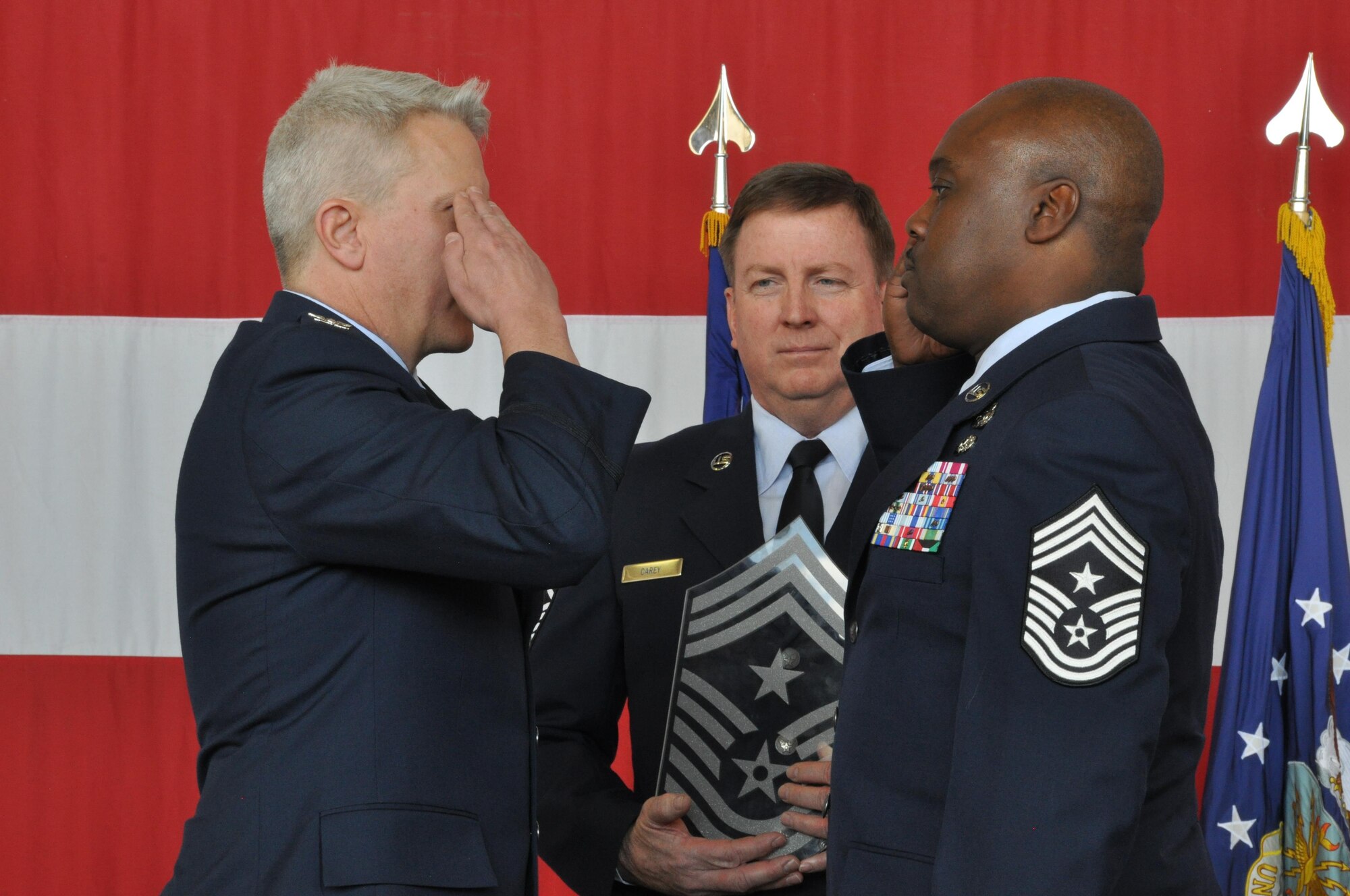 PETERSON AIR FORCE BASE, Colo. -- Chief Master Sgt. Otis L. Jones Jr., right, relinquishes his role and responsibilities as command chief master sergeant of the 302nd Airlift Wing to Col. Erich C. Novak, Vice Wing
Commander of the 302nd AW, during a ceremony April 3, 2016 here. Jones became the Reserve wing's command chief master sergeant in April 2012. Jones was selected for and will serve as the Reserve Individual Mobilization
Augmentee, Aide to the Command Chief, Air Force Sustainment Center, Tinker AFB, Okla. in his next assignment (U.S. Air Force photo/2nd Lt. Stephen Collier)
