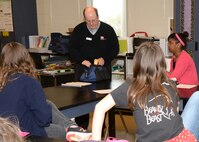 Jerry Henley, a U.S. Army Engineering and Support Center Huntsville electrical engineer, shows Ms. Smith's fifth and sixth grade Science, Technology, Engineering and Math lab students some tools he uses to do his job during Mill Creek Elementary School's career day April 8.