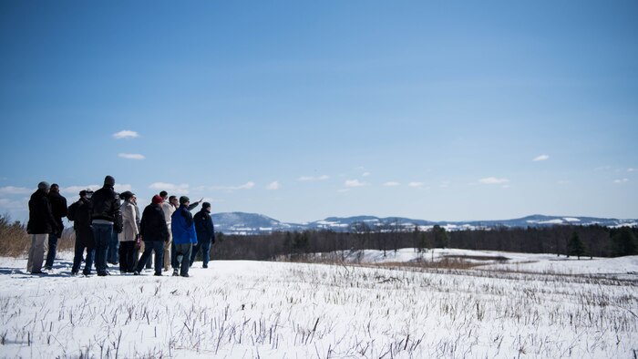 The Marines with the Expeditionary Warfare School battle site study group make a short stop to talk about the terrain of the battlefield and about what kind of tactics the officers of the Revolutionary War used during their trip to Saratoga Springs, New York, April 5, 2016. The Marines talked about tactics such as reverse slope defense versus forward slope defense, and cover versus concealment.