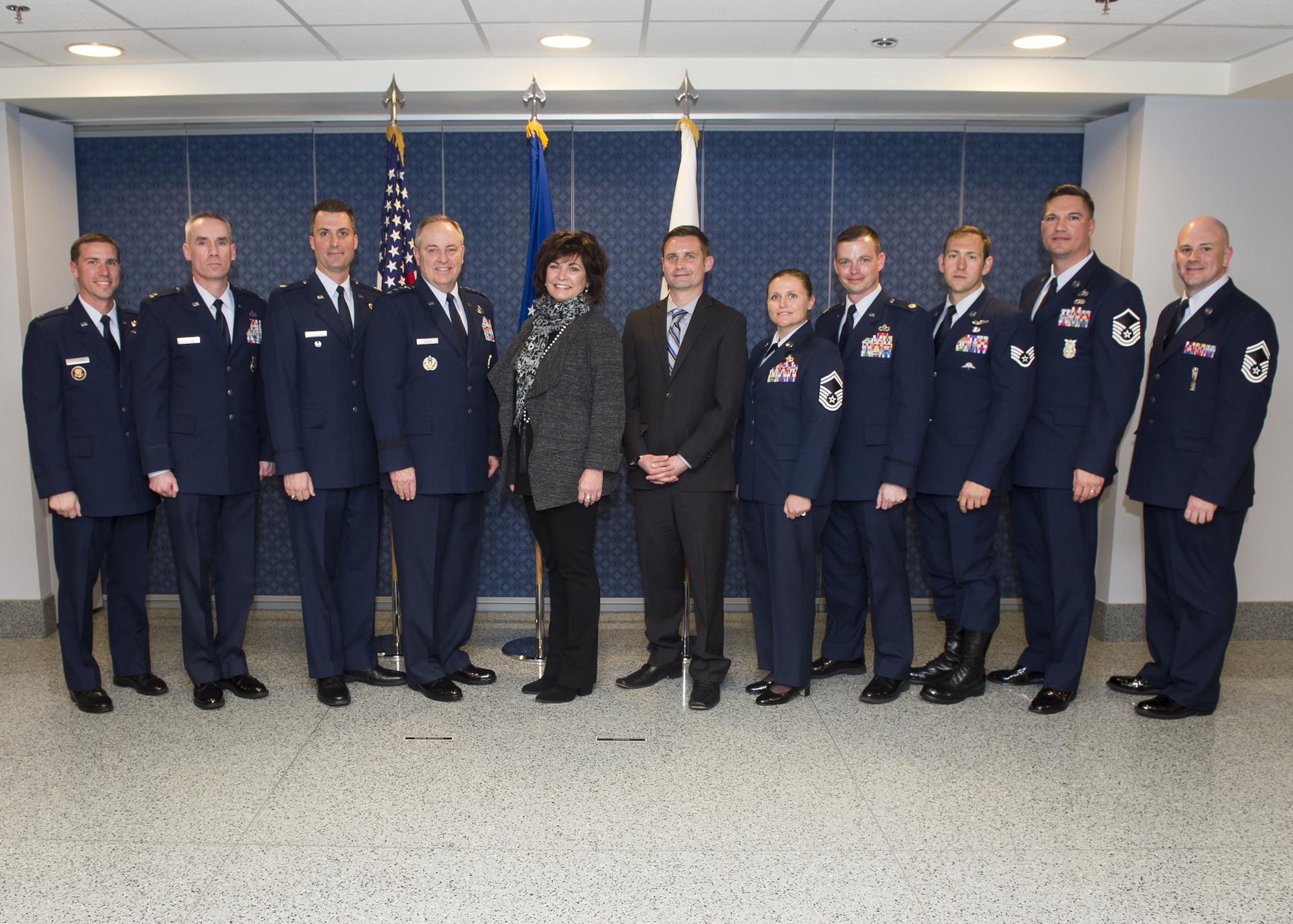 Air Force Chief of Staff Gen. Mark. A Welsh III and Janine Rozina pose for a photo with the 2014 and 2015 Lance P. Sijan Leadership Award winners following the award ceremony at the Pentagon in Washington, D.C., April 7, 2016. Rozina is Sijan's sister. Each year, the award is given to a senior and junior officer and a senior and junior enlisted member who demonstrated outstanding leadership abilities. The 2014 winners are: Lt. Col. Stephen Matthews, Capt. John Sullivan, Master Sgt. Janell McGivern and Senior Airman Tristen Windel. The winners for 2015 are: Maj. Patrick Kolesiak, Capt. David Plachno, Senior Master Sgt. Justin Deisch and Tech. Sgt. Kevin Henderson. (U.S. Air Force photo/Jim Varhegyi)