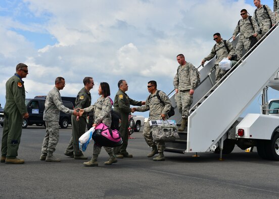 Leaders from the Hawaii Air National Guard’s 154th Wing and the Active-duty 15th Wing greeted Airmen from the Hawaiian Raptors as they return from a six-month deployment, Joint Base Pearl Harbor-Hickam, April 5, 2016. The Hawaiian Raptors are made up of F-22 pilots from the 199th Fighter Squadron and the active-duty 19th Fighter Squadron and are supported by the Hawaii Air National Guard’s 154th Maintenance Squadron and the active-duty 15th Maintenance Squadron. This marked the first operational deployment for the Hawaiian Raptors. (U.S. Air Force photo by Tech. Sgt. Aaron Oelrich/released)  